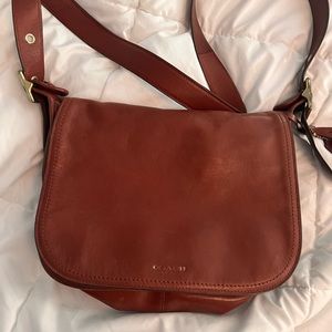 Coach saddle leather crossbody : handbag.  It’s the Patricia bag
